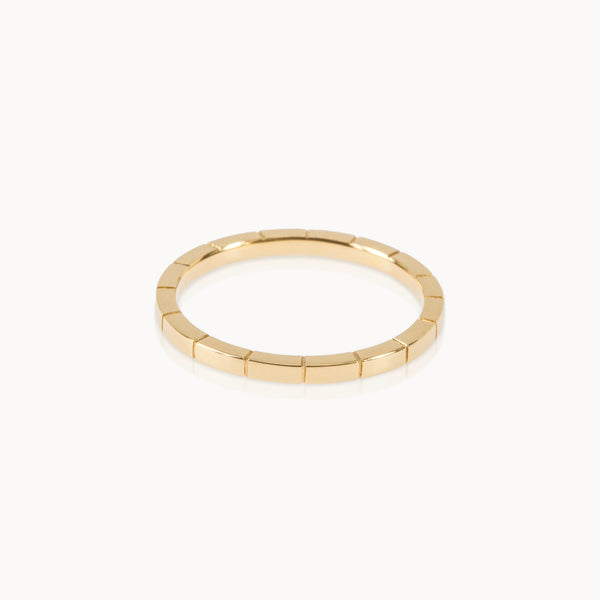 Simple gold band with engraved line texture, contemporary minimalist jewellery style in eco-friendly Fairmined gold.