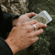 Man wearing an eco-friendly silver ring. This sustainable Domed Band is handmade in Cape Town in recycled silver from e-waste.