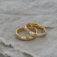 Set of Domed eco-friendly recycled gold wedding bands one with lab grown diamonds