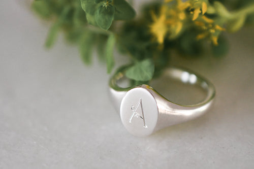 Hand Engraved Oval Signet Ring with Leaf Inspired Font