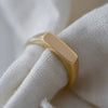 Minimalist ethical 9K gold signet ring, handcrafted with responsibly mined gold