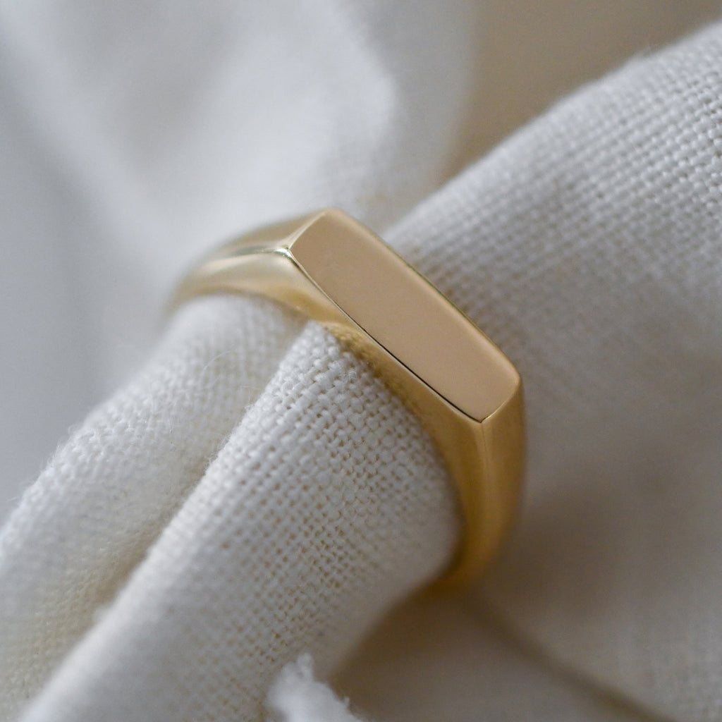 Minimalist ethical 9K gold signet ring, handcrafted with responsibly mined gold