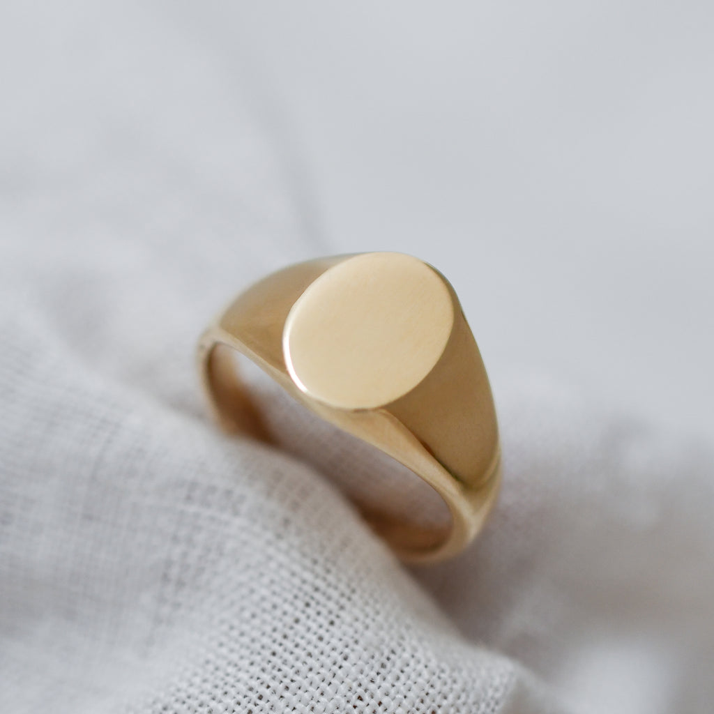 Fairmined eco-friendly gold signet ring with timeless oval face design.