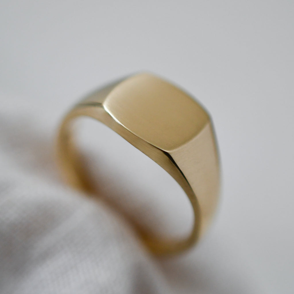 Handcrafted ethical gold signet ring made from Fairmined eco-friendly 9K yellow gold.