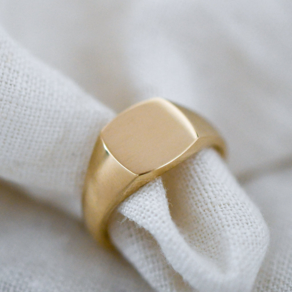 Bold square signet ring handcrafted in Cape Town from Fairmined certified 9K yellow gold.