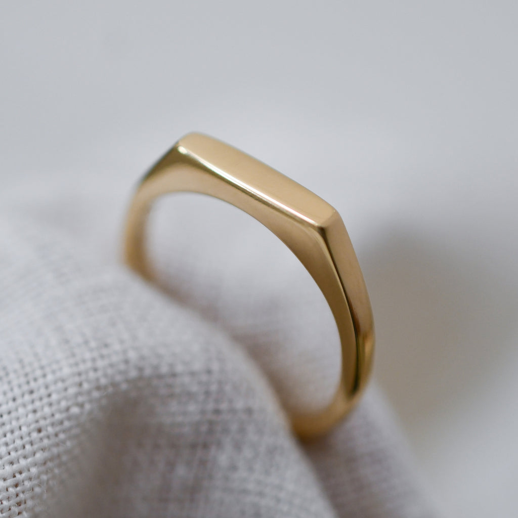 Dainty ethical gold signet ring handcrafted from Fairmined eco-friendly gold
