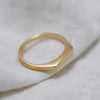 Minimalist dainty signet ring in 9K yellow gold. Sustainably made jewelry