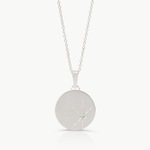 Sterling silver necklace with a round pendant set with a lab grown diamond and engraved