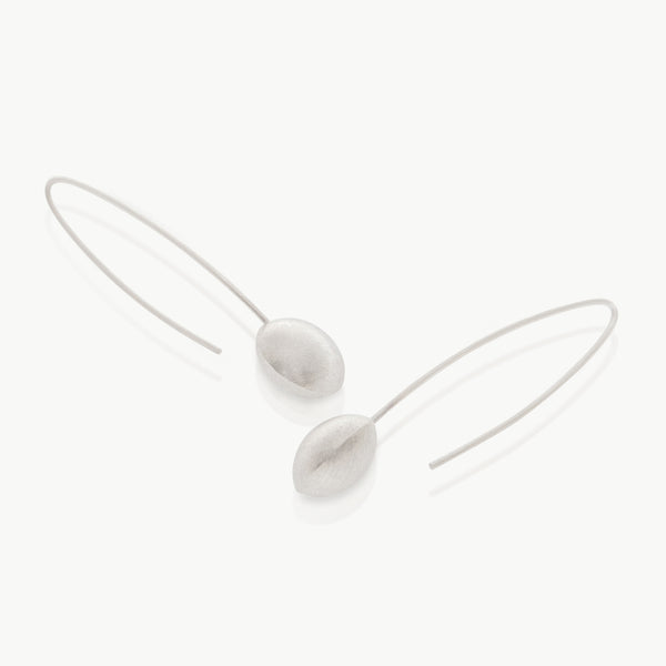 A customer design favourite of 15 years – A silver wired drop earring culminating in an ethically mined sterling silver dome. Hand crafted in Cape Town.