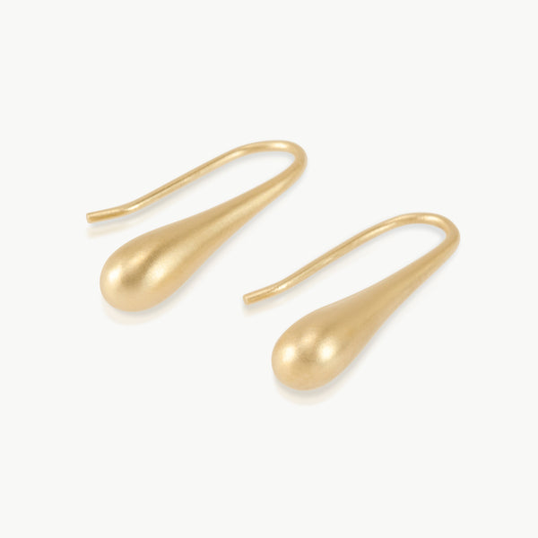Imagine an extended water droplet about to fall from a leaf, this elongated drop earring design is nature inspired and hand crafted in Cape Town, South Africa in 9K gold.