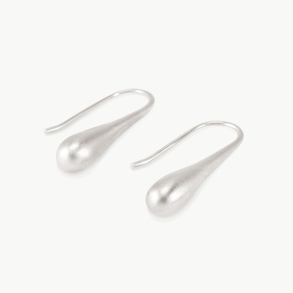 Imagine an extended water droplet about to fall from a leaf, this elongated drop earring design is nature inspired and hand crafted in Cape Town, South Africa.