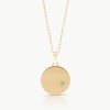 Handcrafted by an independent jeweller in Cape Town – A large disc necklace in solid 9K gold and set with a lab-grown diamond, inspired by the night sky.  