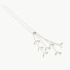 Inspired by the grasslands – 4 grass heads hanging from a chain, handmade in Fairmined certified sterling silver in our studio in Cape Town, South Africa.