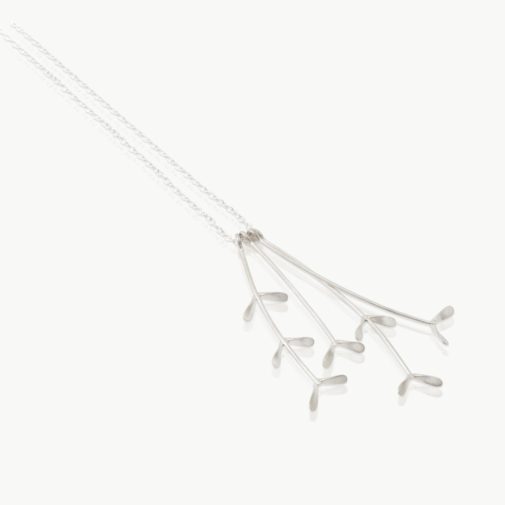 Inspired by the grasslands – 4 grass heads hanging from a chain, handmade in Fairmined certified sterling silver in our studio in Cape Town, South Africa.
