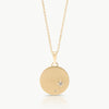 Inspired by starry skies – A disc necklace in solid 9K gold set with 2 lab-grown diamonds in an engraved setting expertly hand crafted by artisans in Cape Town.