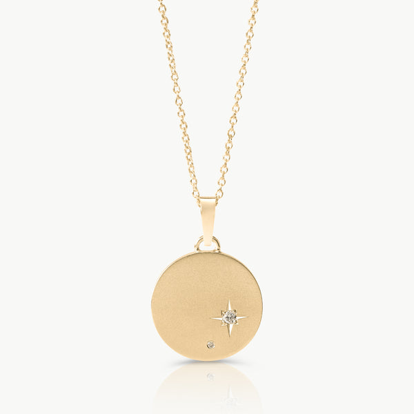 Inspired by starry skies – A disc necklace in solid 9K gold set with 2 lab-grown diamonds in an engraved setting expertly hand crafted by artisans in Cape Town.