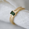 Green sapphire ring in 9ct gold with hand-engraved leaf detail on the band