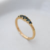 Blue sapphire ring with five graduated stones set in a Fairmined gold band