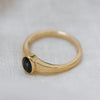 Ethical jewellery piece featuring one oval blue sapphire in a gold bezel