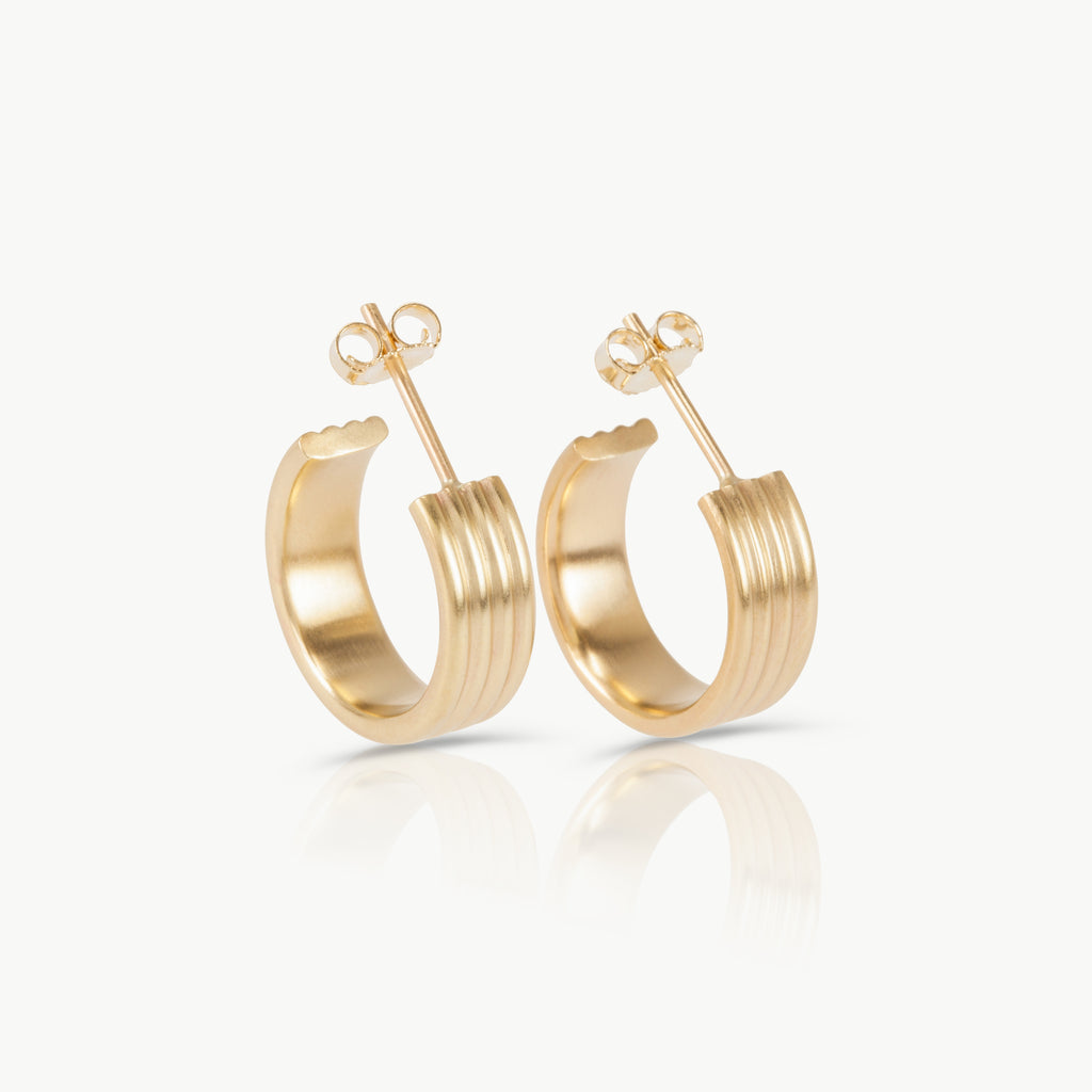 Ripple earrings crafted in 9k yellow Fairmined gold with soft, organic wave-like curves. Minimalist sustainable design.