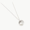 A Fairmined certified sterling silver rounded pebble on a chain. Handmade in our manufacturing studio in Cape Town, South Africa. Customisable with engraving.