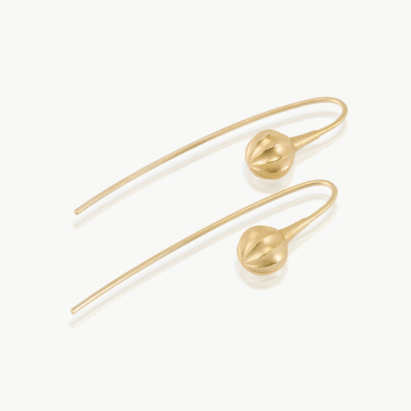 A minimalist seed at the end of a wire drop earring expertly handmade in solid 9 karat gold in our well-established fine jewellery design studio in Cape Town.