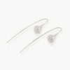A minimalist seed at the end of a wire drop earring expertly handmade in sterling silver in our well-established fine jewellery design studio in Cape Town.