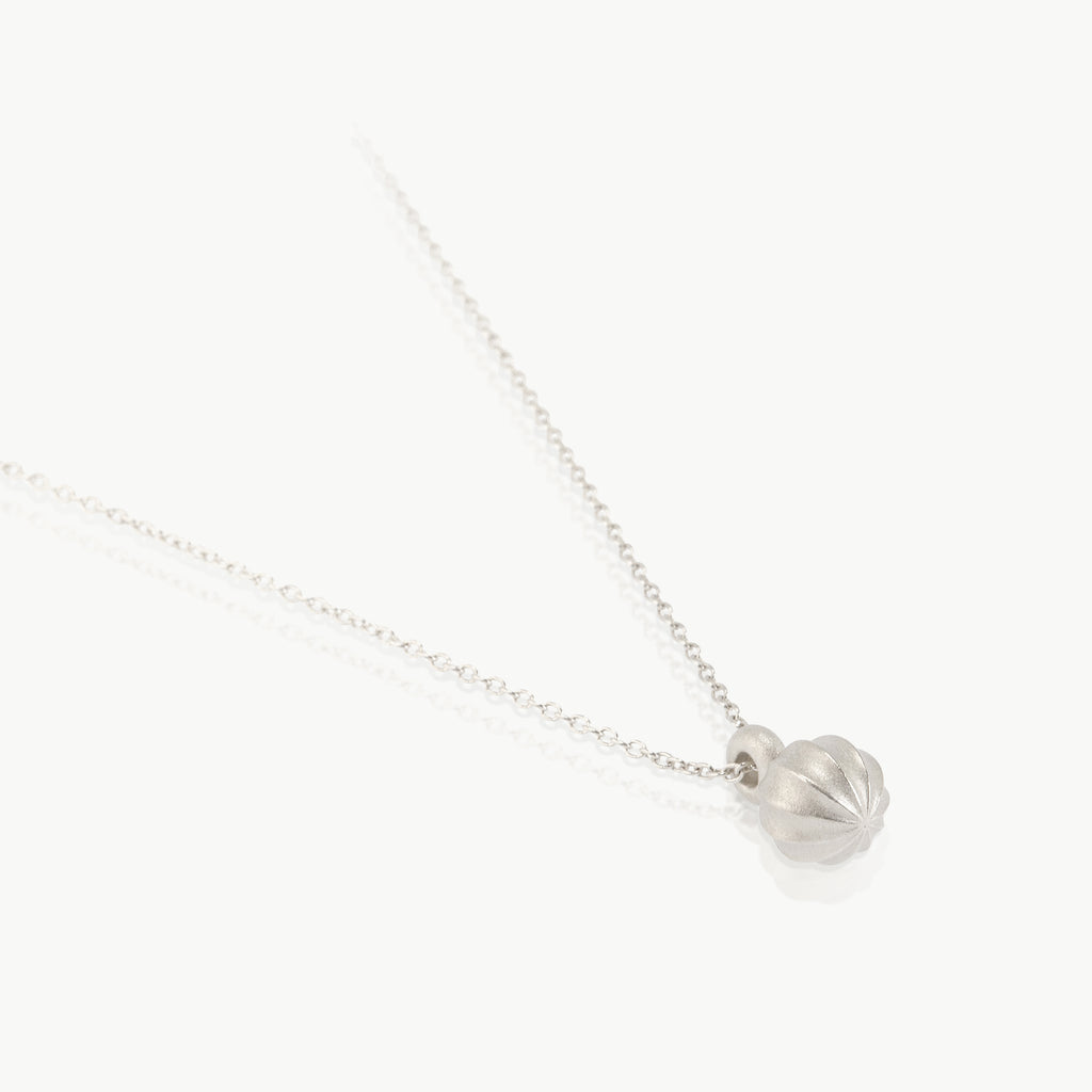 Ethical pendant with a sterling silver seed