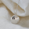 Eco-friendly, nature-inspired round silver pendant on a 50cm chain, handmade in Cape Town from responsibly sourced silver.