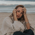 Woman wearing ethical silver bracelet. This minimalist Dancer’s Bangle is handmade in Cape Town in recycled silver from e-waste.