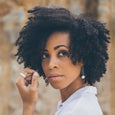 Woman wearing eco-friendly silver earrings. These artisan crafted Dome Earrings  are handmade in Cape Town in recycled silver from e-waste.