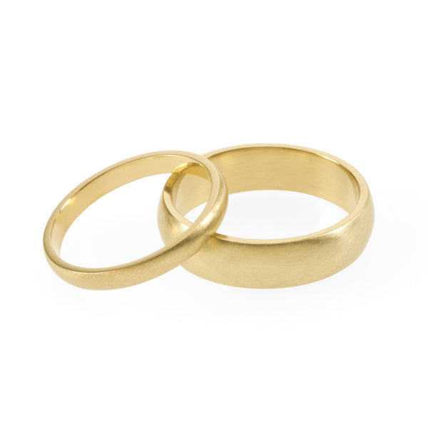Eco-friendly gold rings. These artisan crafted Domed Wedding Bands are handmade in Cape Town in recycled gold from e-waste.