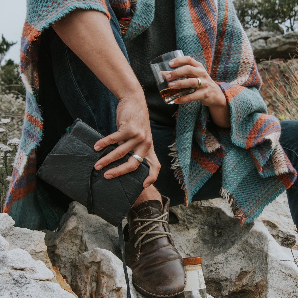 Man wearing an ethical silver ring. This minimalist Domed Band is handmade in Cape Town in recycled silver from e-waste.