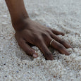 Woman wearing an eco-friendly gold ring. This sustainable Flat Top Ring is handmade in Cape Town in recycled gold from e-waste.