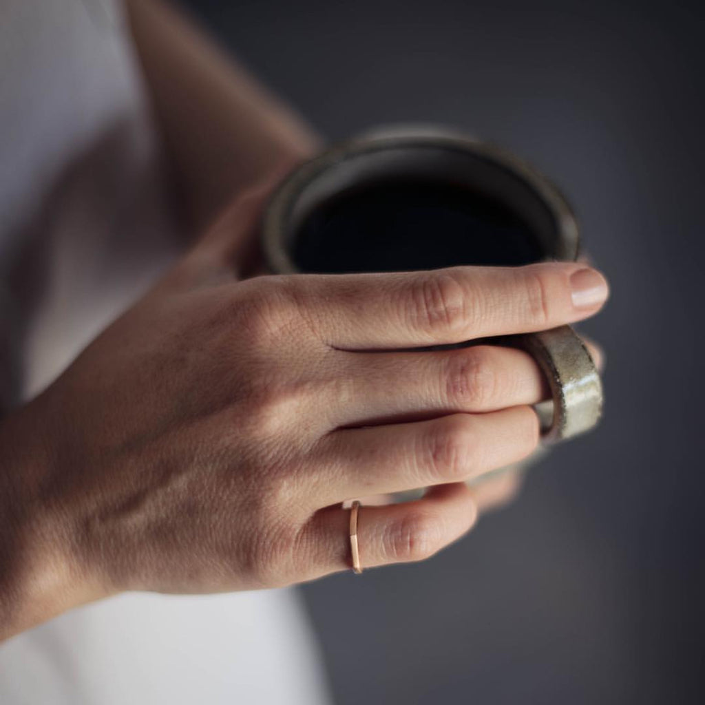 Woman wearing a sustainable silver ring. This artisan crafted Flat Top Ring is handmade in Cape Town in recycled silver from e-waste.