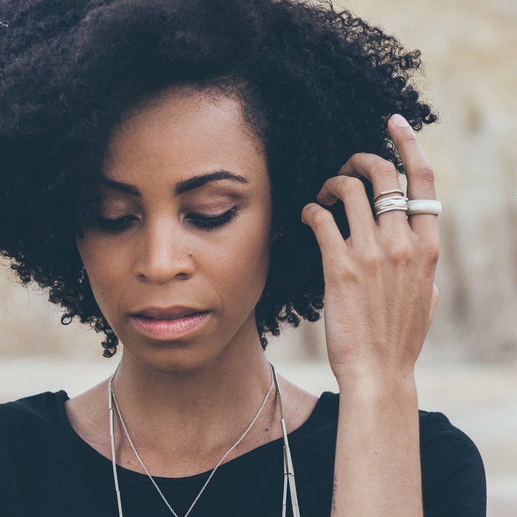 Woman wearing ethical ring. This minimalist Flat Top Ring is handmade in Cape Town in recycled silver from e-waste.