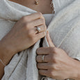 Woman wearing an ethical silver ring. This minimalist Seed Ring is handmade in Cape Town in recycled silver from e-waste.