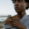 Woman wearing an eco-friendly gold ring. This sustainable Notch Ring is handmade in Cape Town in recycled gold from e-waste.