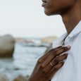 Woman wearing a sustainable silver ring. This artisan  Notch Ring is handmade in Cape Town in recycled silver from e-waste.