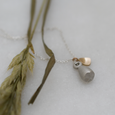 Pod pendant in recycled silver with gold leaf detail. A botanical inspired necklace.