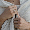 Woman wearing an ethical gold ring. This minimalist Seed Ring is handmade in Cape Town in solid 9K gold.