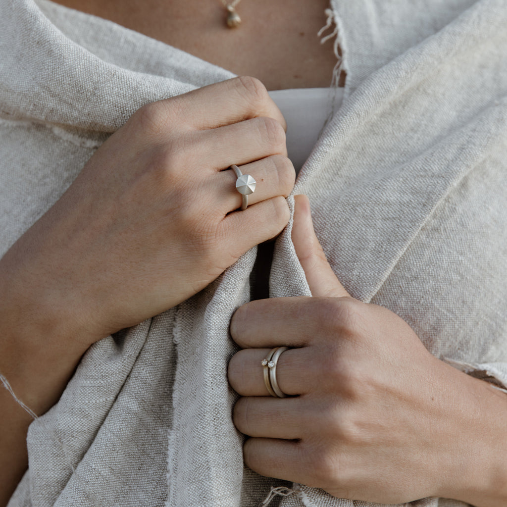 Woman wearing an ethical silver ring. This minimalist Seed Ring is handmade in Cape Town in sterling silver.
