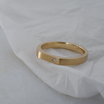 Signet shaped eco-friendly recycled gold wedding band with single ethically sourced diamond