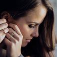 Woman wearing  a sustainable gold ring. This artisan  Twist Ring is handmade in Cape Town in recycled gold from e-waste.