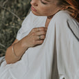 Woman wearing a sustainable gold ring. This artisan  Notch Ring is handmade in Cape Town in recycled gold from e-waste.
