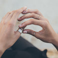 Woman wearing an ethical gold ring. This minimalist Simple Band is handmade in Cape Town in recycled gold from e-waste.